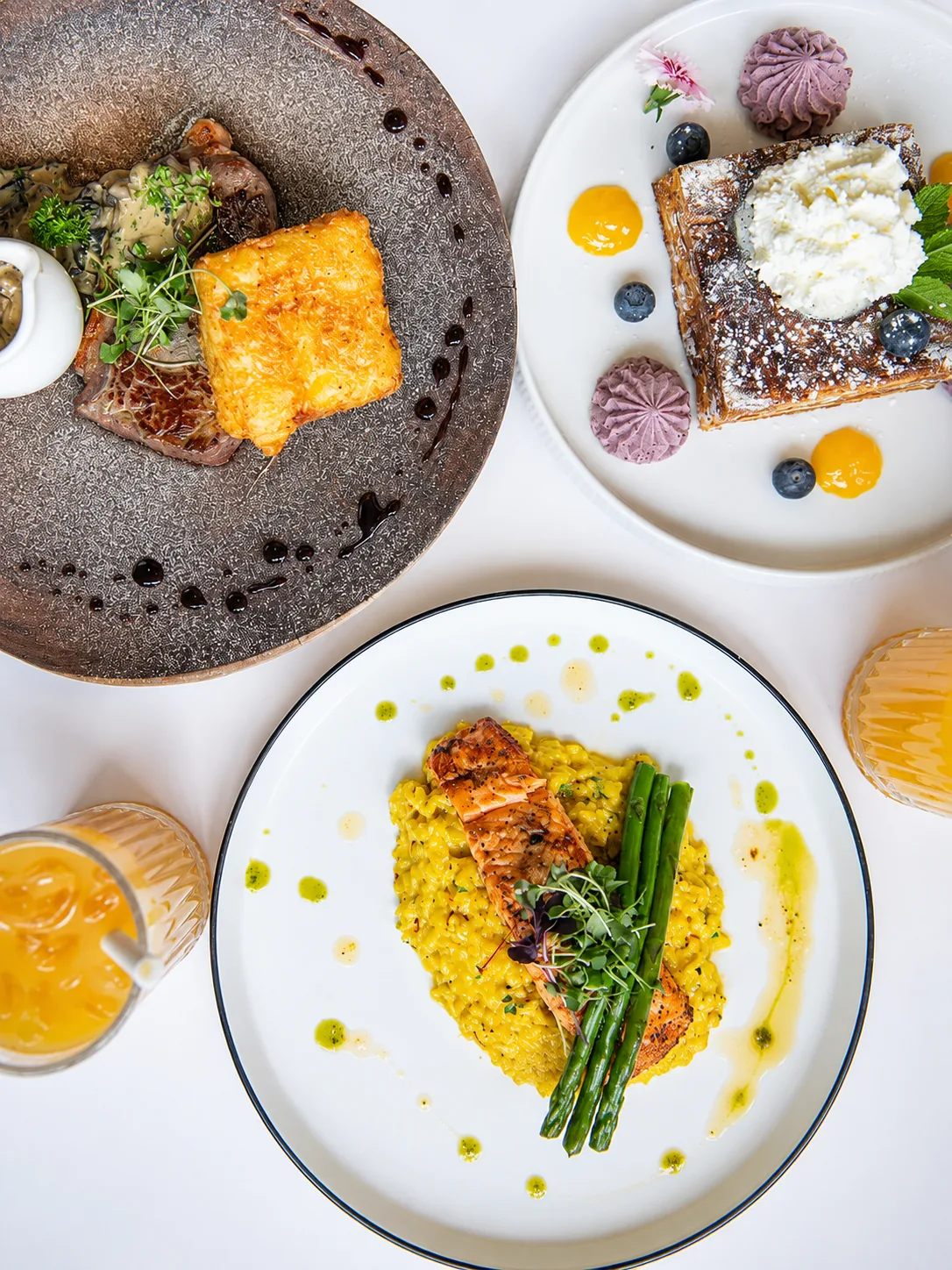A spread of breakfast and lunch plates at Grindz Cafe
