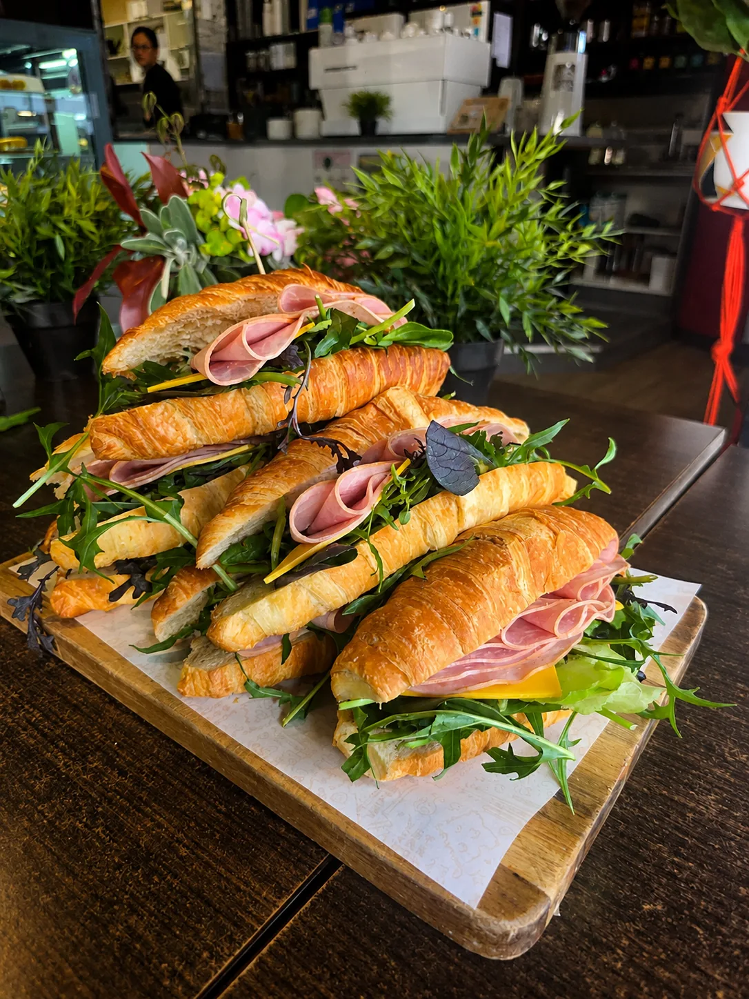Croissant sandwiches with greens and ham at Grindz Cafe