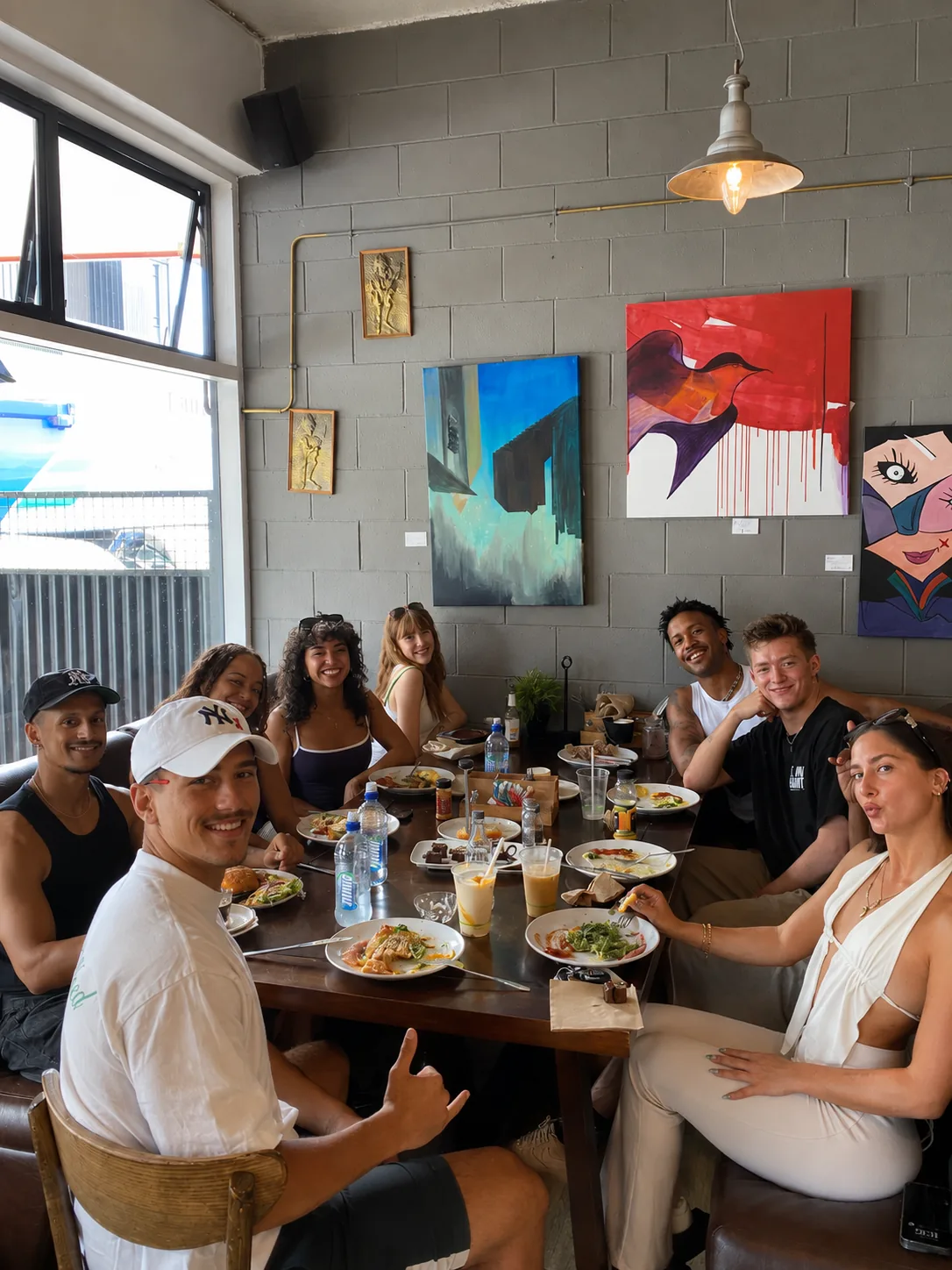 A group dining together inside Grindz Cafe